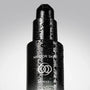 Black skincare bottle with 'Mirror Skin' and 'SKINAD+' branding on a gray background